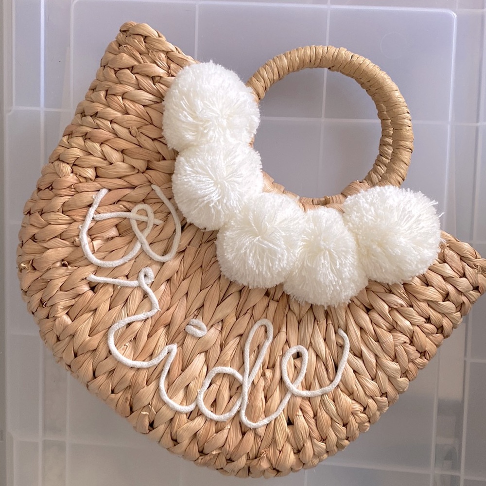 Woven straw Pom-Pom “bride” purse